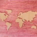 Image of the shapes of large land masses of the world placed on a pink background to illustrate post