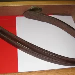 An image of a 'tawse' (school strap) for punishing children in school in Scotland until 1975, to illustrate post