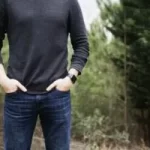 Image of man standing in front of trees with his hands in his pockets to illustrate post