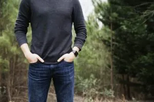 Image of man standing in front of trees with his hands in his pockets to illustrate post