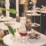 Image of tearoom containing tables and layered cake stand to illustrate post