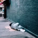 Image of person lying in alley to illustrate post