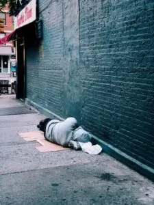 Image of person lying in alley to illustrate post