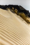 An image of a sand dune with ridges in it to illustrate post