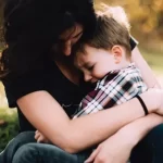 Image of a woman cuddling a boy to illustrate post