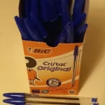 Image of BIC pens in a box, with three lying in front of the box, to illustrate post