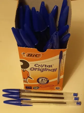 Image of BIC pens in a box, with three lying in front of the box, to illustrate post