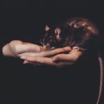 Image of person holding a mouse in their hands, used to illustrate post.