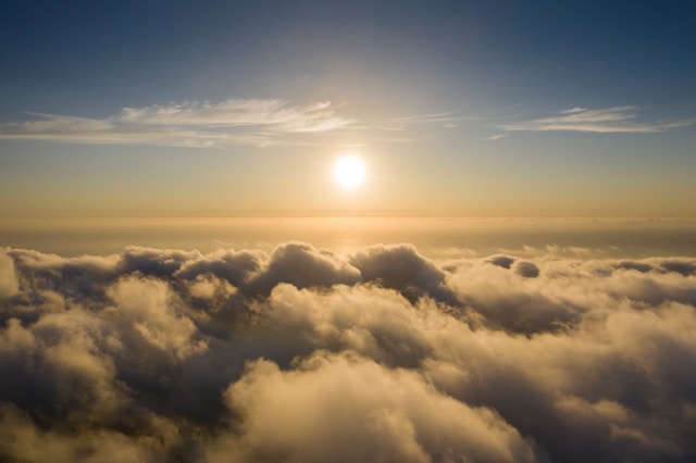 Image of the sun setting over clouds, used to illustrate post