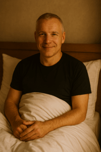 Image of a man sitting up in bed. The image is used to illustrate the post.